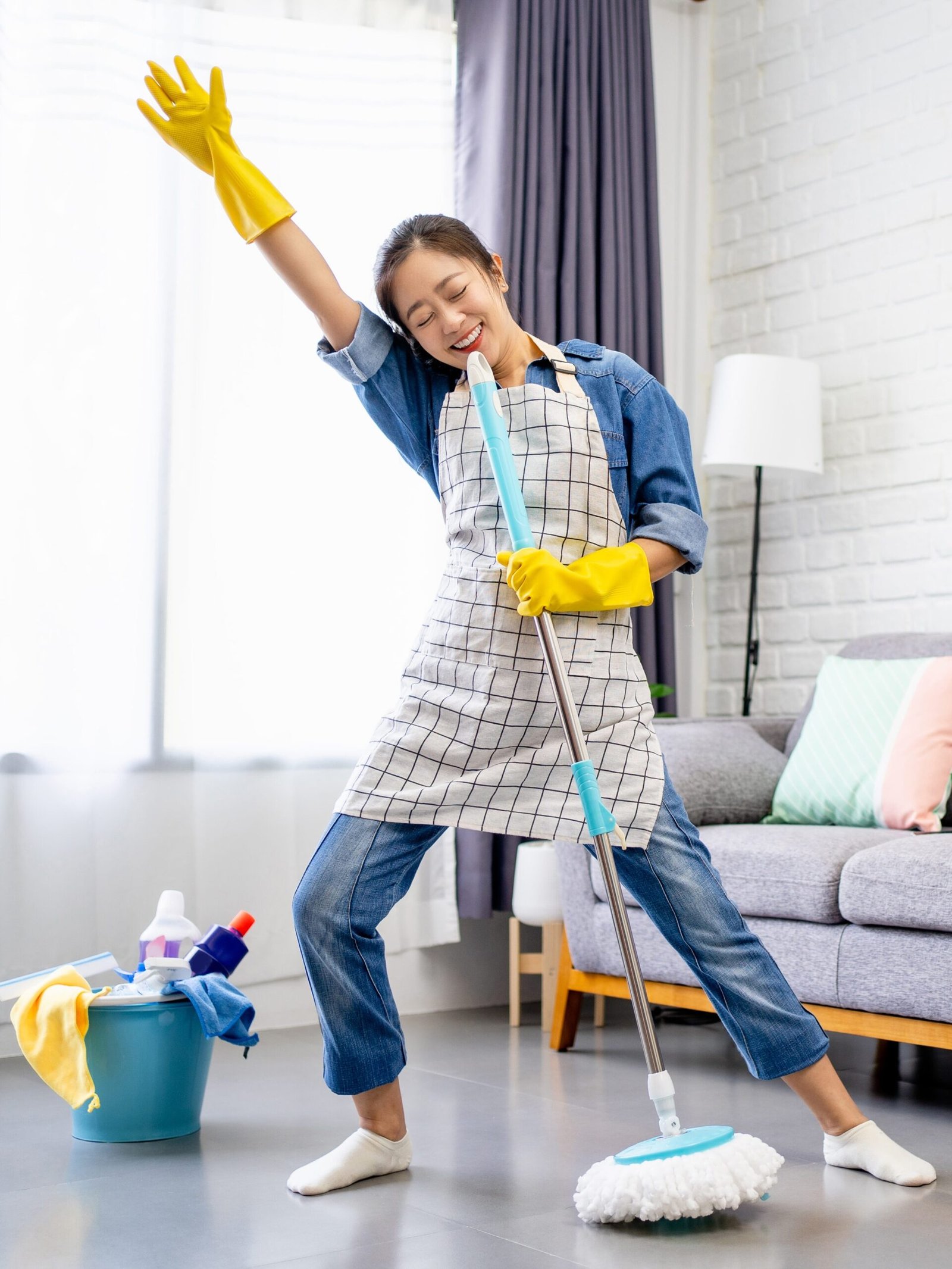 Happy,Young,Asian,Woman,Cleaning,Her,Home,,Singing,At,Mop Stress-free professional cleaning services for your home or business. SRS Cleaning offers professional, reliable, and trusted cleaning services to homeowners and businesses in Orange County, California.